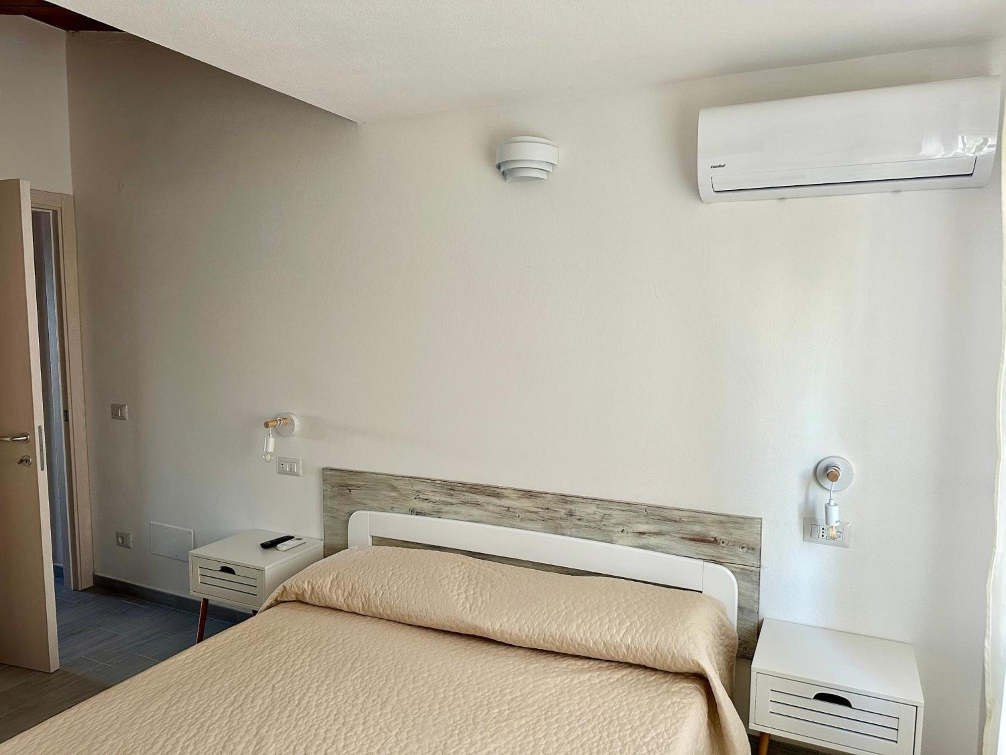 Approdo Apartments Isola Rossa Exterior photo