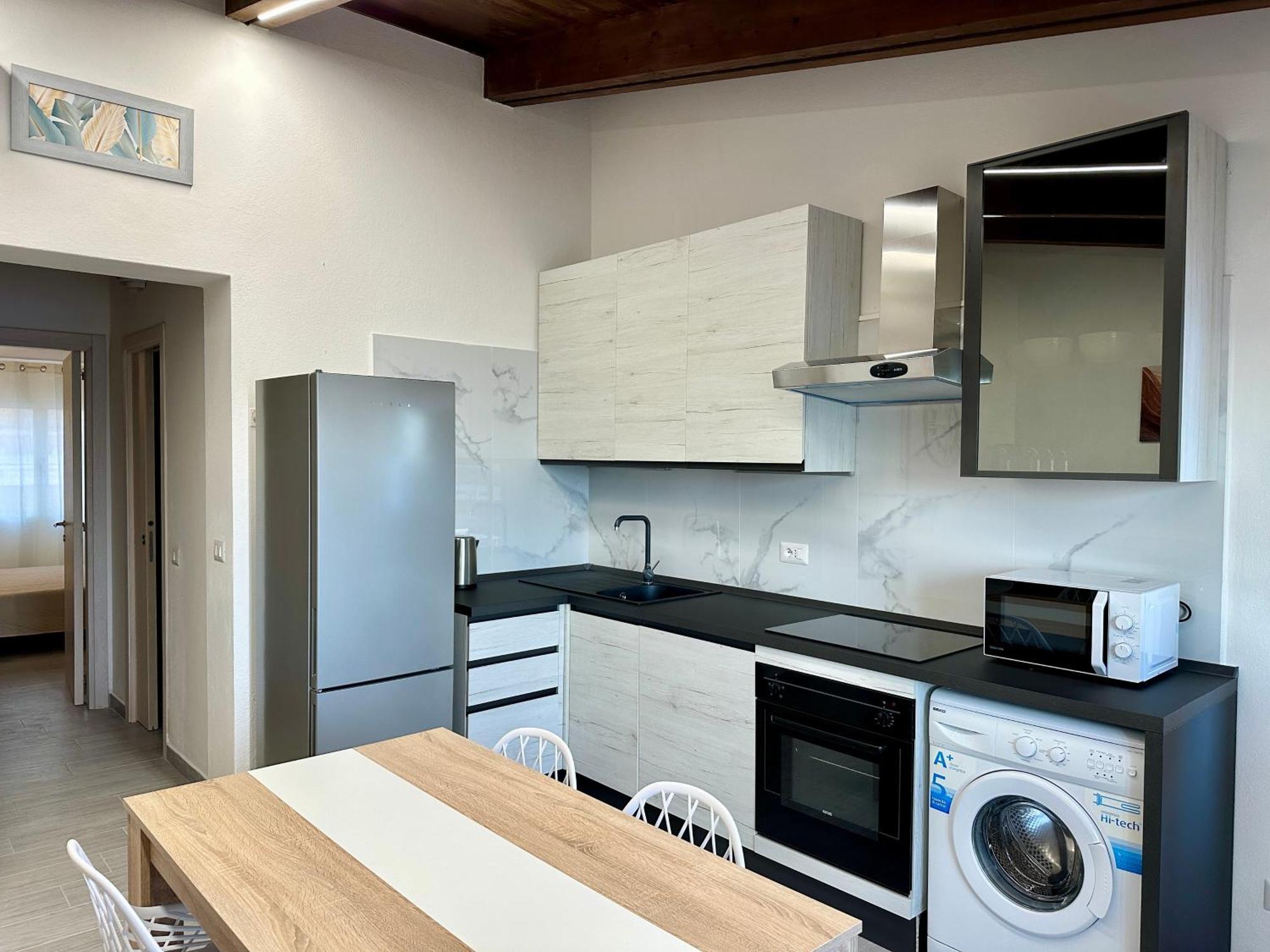 Approdo Apartments Isola Rossa Exterior photo