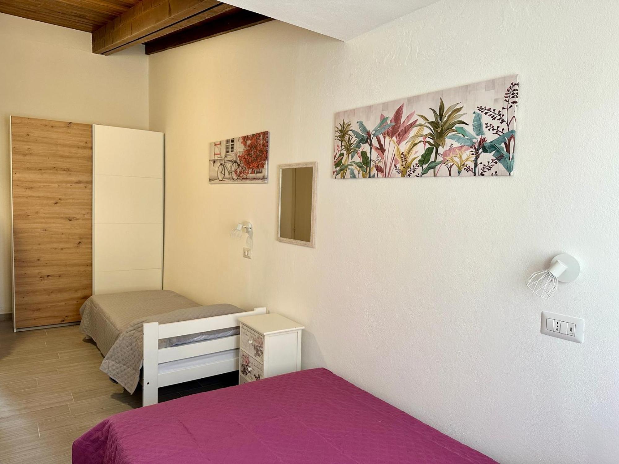 Approdo Apartments Isola Rossa Exterior photo