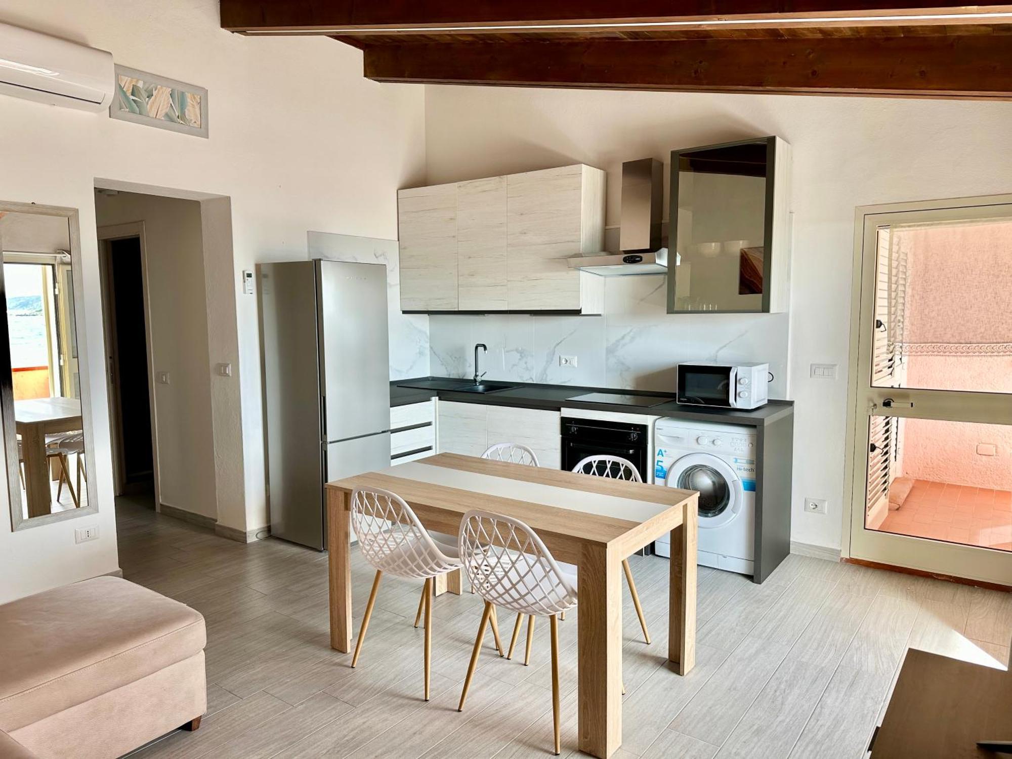 Approdo Apartments Isola Rossa Exterior photo